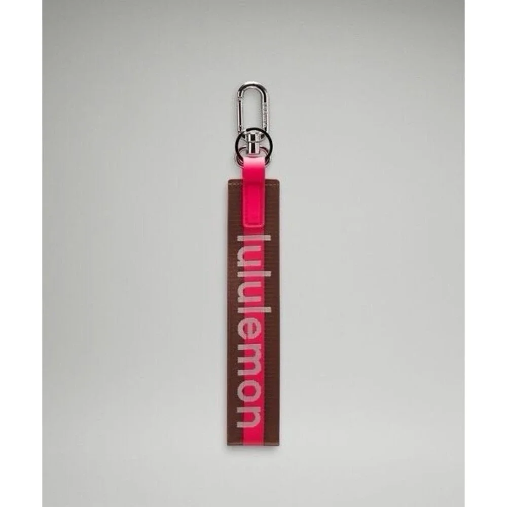 Lululemon Never Lost Keychain Wordmark Brown Pink One Size NWT